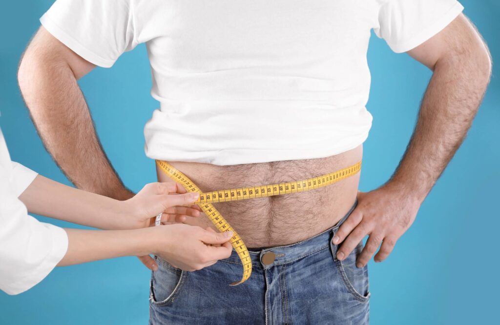 mens-waist-being-measured-by-doctor