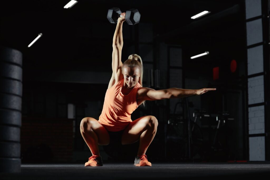 woman overhead squat good physique